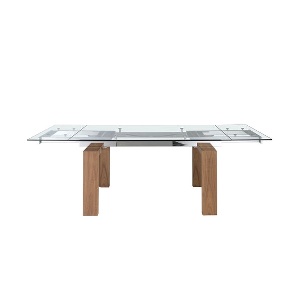 Mesa de Comedor Extensible 1007 extendida, vista de frente: la superficie queda continua y las patas de nogal van retranqueadas hacia el centro