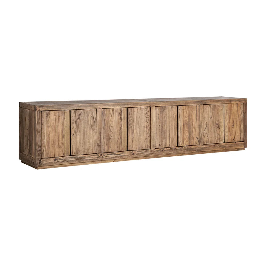 Mueble TV Norvik en ángulo, con sus 280 cm de largo, el lateral macizo y el zócalo retranqueado